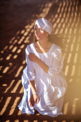 Beautiful woman resting in the desert