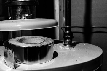 selective focus on the edge of a roll of metallic aluminum foil HVAC duct tape