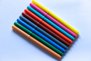 Fototapeta premium Coloured Pens on White Background