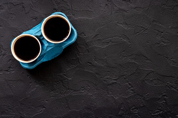 Coffee to go background. Black coffee in paper cups, top view