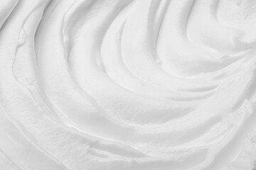 Whipped white cream as background, closeup view