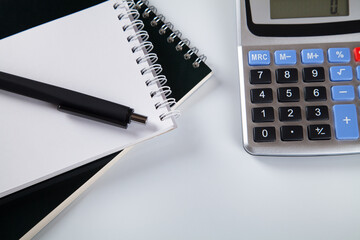Office desktop with calculator and business accessories isolated on white background. Business concept.
