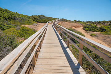 wooden boardwalk in dune landscape, West Algarve Portugal
