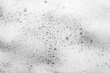 White foam background, soap froth bubbles texture, lather surface, detergent, laundry spume, hygiene soap sud, cosmetic cleanser, shampoo, shower gel, foamy bathtub, sea water foam, ocean wave froth