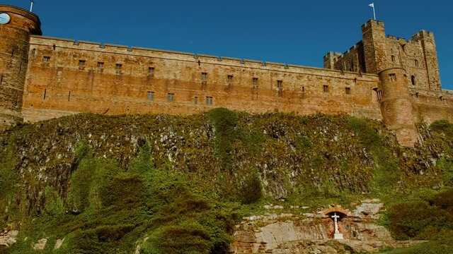 Wide view of Bamburgh Castle, dating to 11th century and the seat of the former Kings of Northumbria, Northumberland, England, UK