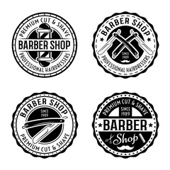 Barber shop set of four vector round badges, emblems, labels or logos in vintage style isolated on white background
