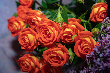 a big large lush bouquet of orange roses