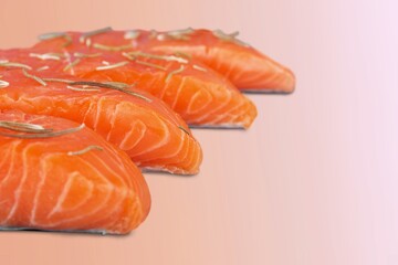 Fresh raw salmon fillet with greens and spices.