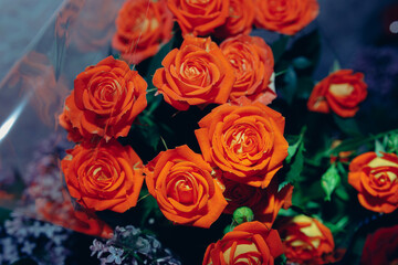 a big large lush bouquet of orange roses