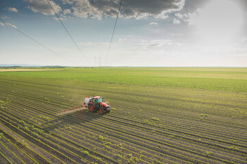 Spraying pesticides at soy bean fields