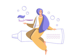 Smiling woman with a toothbrush and toothpaste.