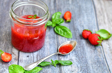 Home made ketogenic   organic  bio strawberry jam and fresh strawberryes  on wooden background. 