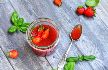 Home made ketogenic   organic  bio strawberry jam and fresh strawberryes  on wooden background. 