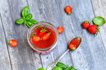 Home made ketogenic   organic  bio strawberry jam and fresh strawberryes  on wooden background. 