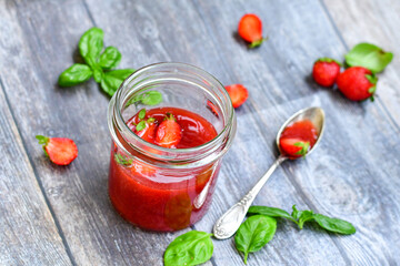 Home made ketogenic   organic  bio strawberry jam and fresh strawberryes  on wooden background. 