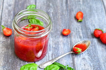 Home made ketogenic   organic  bio strawberry jam and fresh strawberryes  on wooden background. 