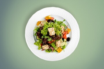 Fototapeta na wymiar Classic tasty salad with fresh vegetables, cheese. Healthy food.