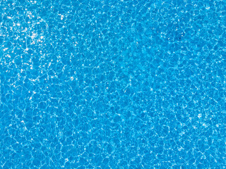 Blue ripped water in swimming pool. water surface background. summer background