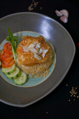 Fried rice with crab on fried egg - Asian food style