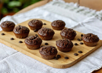 Homemade chocolate muffins on a wooden table