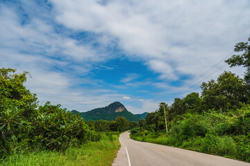 landscape of the road with the mountain in country side of thailand.