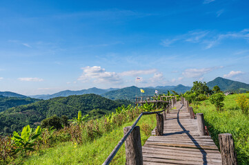 Fototapeta na wymiar Beautiful landscape view and wooden bridge on Phu Lamduan at loei thailand.Phu Lamduan is a new tourist attraction and viewpoint of mekong river between thailand and loas.