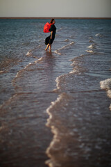 Beautiful woman relaxes by the sea