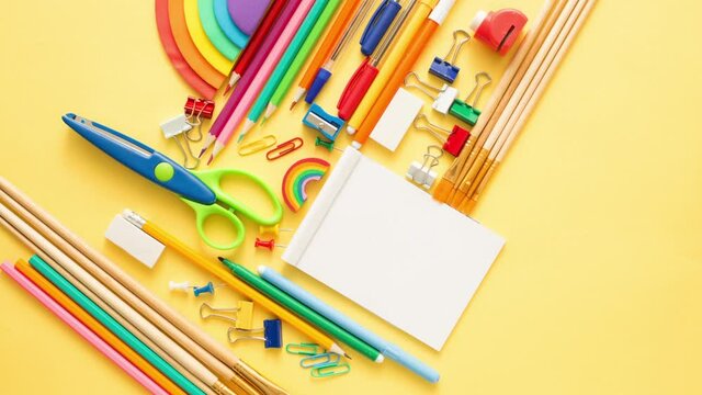 Stop motion colorful school and office supplies on yellow background.Copy space.Flat lay. Back to school concept