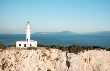 Fototapeta na wymiar White lighthouse at the Greek island Lefkada, Cape of Ducato.