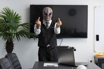 Aggressive a humanoid Alien  in a white shirt, business suit looking at camera and showing double...