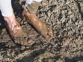 Muddy Feet of a Young Woman