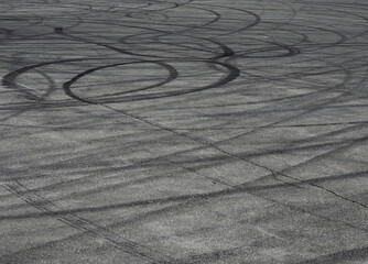 Fototapeta na wymiar Tire tracks left on the hot asphalt