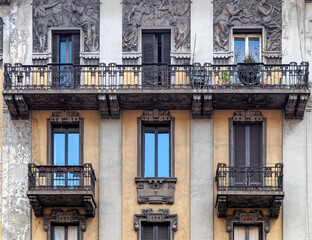 Milan Italy, vintage house decorated front facade