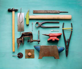 Old hand tools for metalsmith craft, flat lay