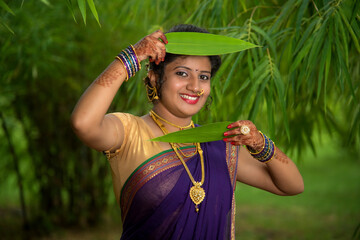 Indian Traditional Beautiful young girl in saree posing outdoors