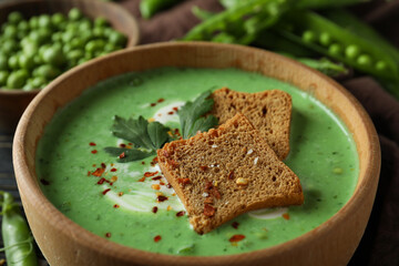Concept of tasty eating with pea soup, close up