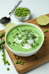 Concept of tasty eating with pea soup on white background