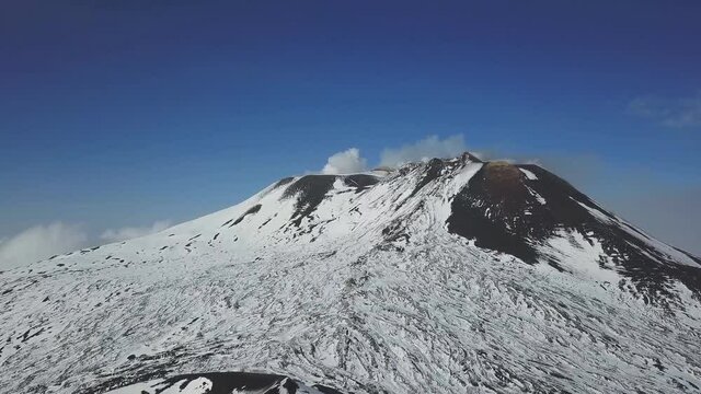 Mount Etna on Sicily Island, Italy. Aerial view of Etna volcano in winter, January 2019.