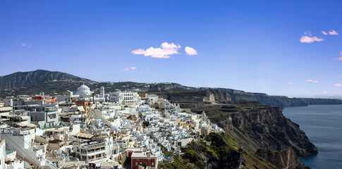 Santorini island, Greece. Fira village caldera over Aegean sea, blue sky, calm sea