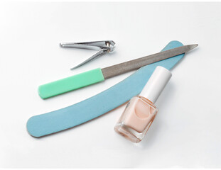 Manicure and pedicure nail care tools set on white background.