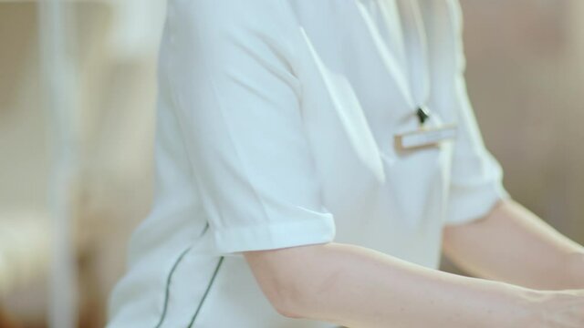 Closeup on woman worker with clipboard and laptop in modern beauty salon. This video was made with PRORes 422 codec.