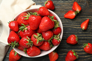 Concept of tasty eating with fresh strawberry on wooden table