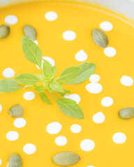 Close up view of pumpkin cream with pumpkin seeds.