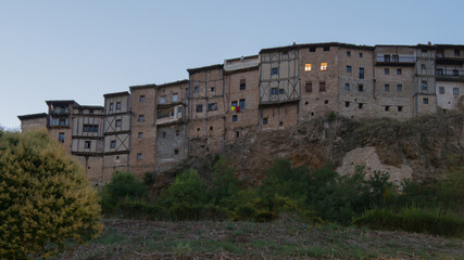 Fototapeta na wymiar Beautiful view of Frias at sunset seen from the low part of the town. Traditional houses.Burgos, Merindades, Spain