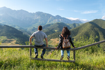 a couple is enjoying amazing views in picos de europa © jon_chica