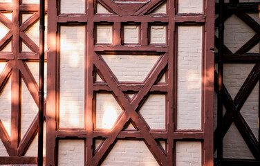 Background of a building wall with wood paneling. Geometric shapes. Modern architecture and design.