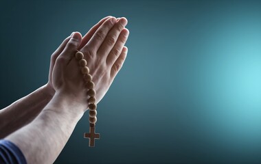 Hands clasped. Man hands in praying position on dark background. Faith in religion