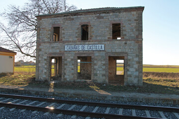 Fototapeta premium Old abandoned train station in the town of Las Cabañas de Castilla, in the province of Palencia (Spain), during winter