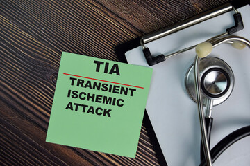 TIA - Transient Ischemic Attack write on sticky notes isolated on Wooden Table. medical concept