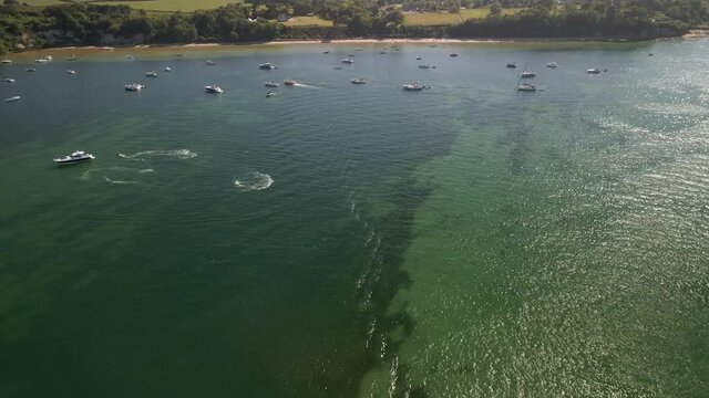 Aerial view of Studland beach and boats on the sea on a hot summer day, bank holiday 
